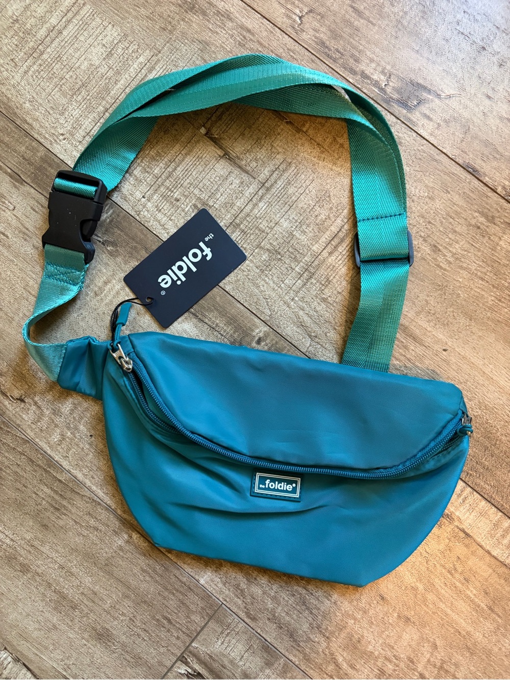 NWT The Foldie teal RFID safe travel bag fanny pack /crossbody